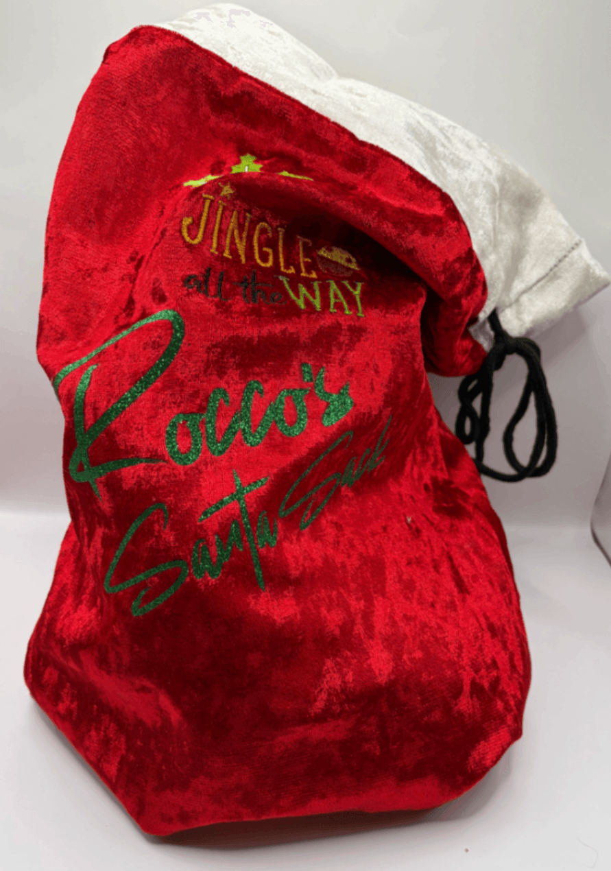 Close view of a red velvet Fur Baby Santa Sack with Santa Paws design